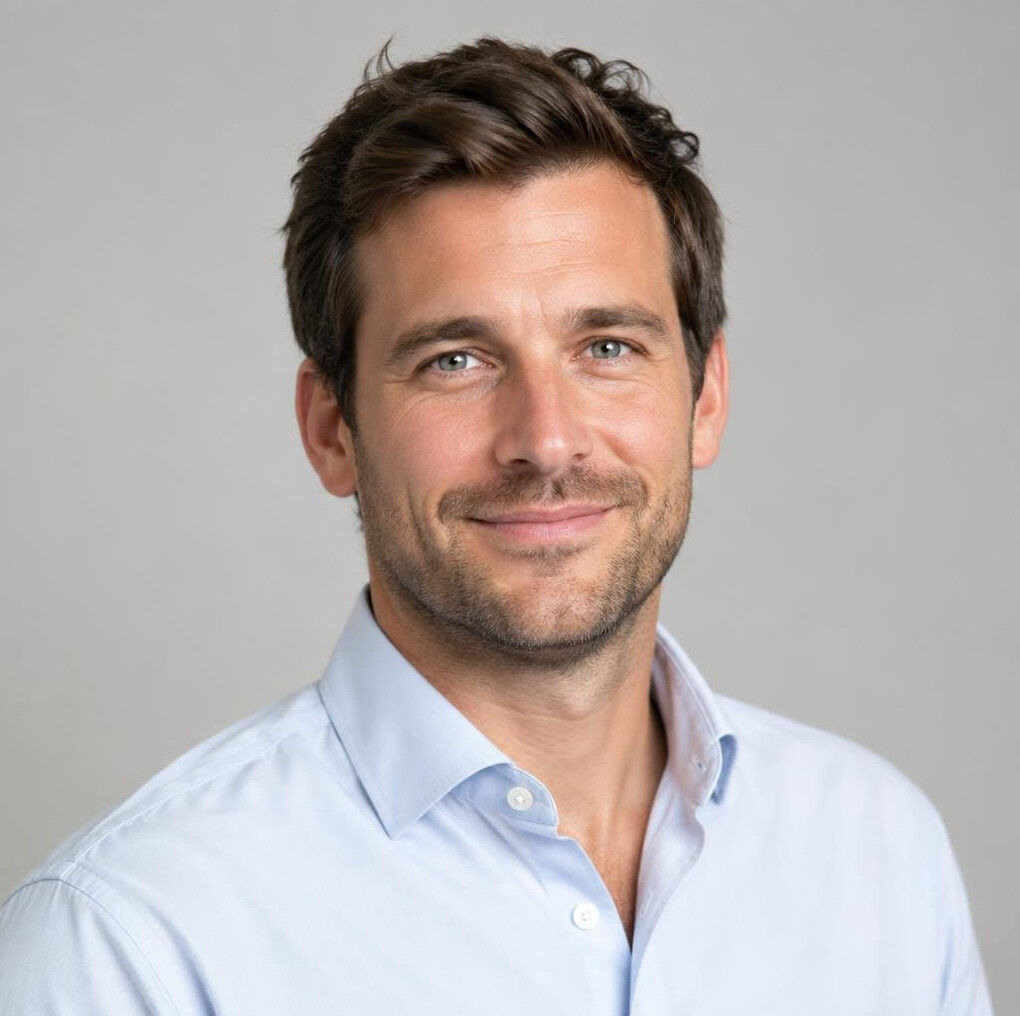 Portrait of a man with short hair smiling